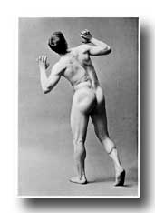 Male Figure Photography - Back View of a Man Looking Upwards with Strained Gesture of Alarm